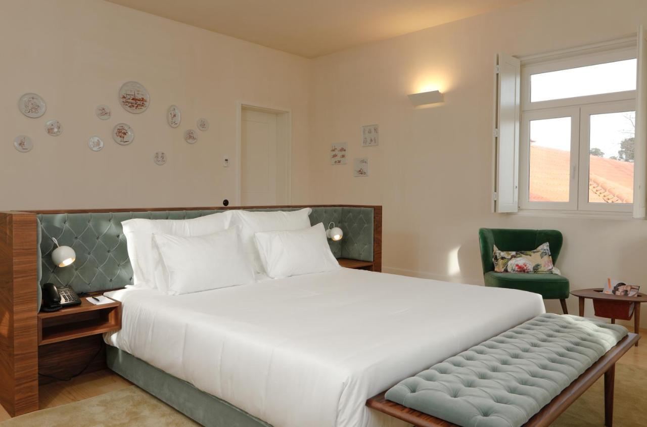 Montebelo Vista Alegre Ilhavo Hotel ภายนอก รูปภาพ A bedroom at the hotel
