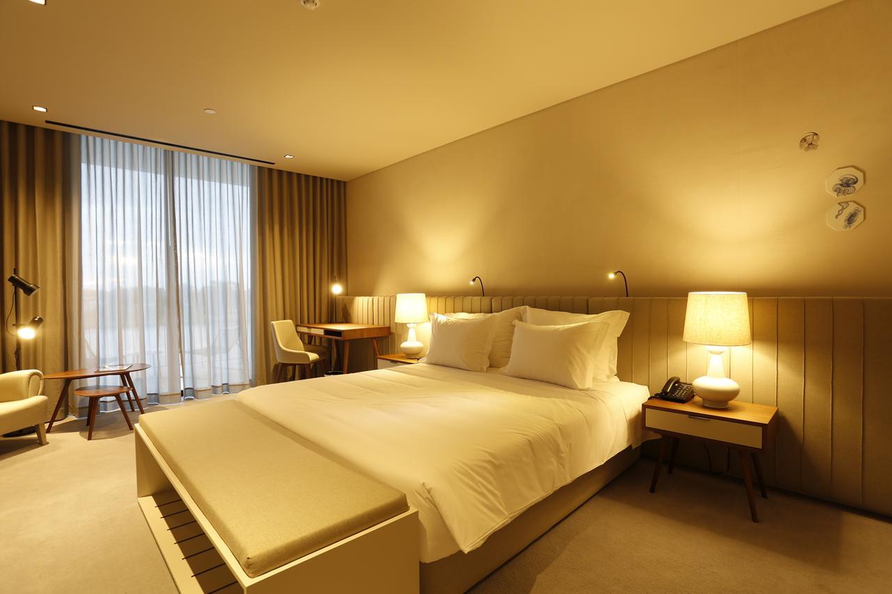 Montebelo Vista Alegre Ilhavo Hotel ภายนอก รูปภาพ A room at the hotel